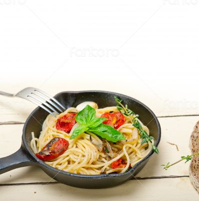 spaghetti pasta with baked cherry tomatoes and basil 