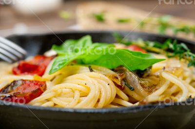 spaghetti pasta with baked cherry tomatoes and basil 