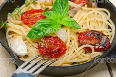 spaghetti pasta with baked cherry tomatoes and basil 