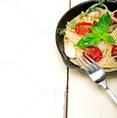 spaghetti pasta with baked cherry tomatoes and basil 