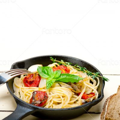spaghetti pasta with baked cherry tomatoes and basil 
