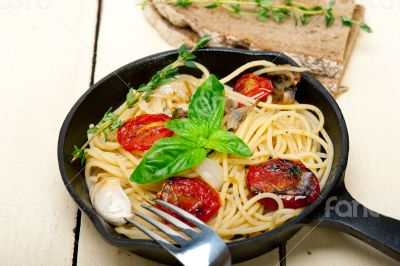 spaghetti pasta with baked cherry tomatoes and basil 
