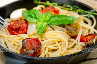 spaghetti pasta with baked cherry tomatoes and basil 