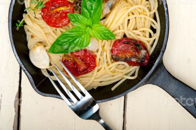 spaghetti pasta with baked cherry tomatoes and basil 