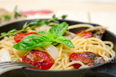 spaghetti pasta with baked cherry tomatoes and basil 