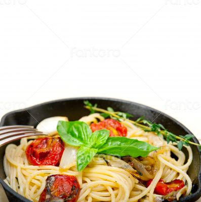 spaghetti pasta with baked cherry tomatoes and basil 