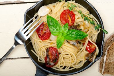spaghetti pasta with baked cherry tomatoes and basil 