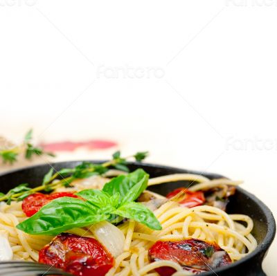 spaghetti pasta with baked cherry tomatoes and basil 