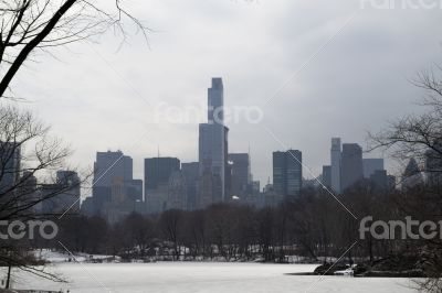 Midtown in winter from Central Park by and frozen podn