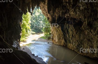 Entrance to the Tham Lod cave with stalactite and stalagmite