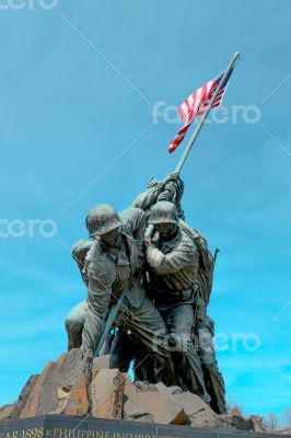 Statue of soldiers with the American Flag