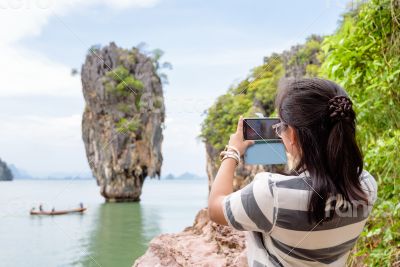 Women tourist shooting view by mobile phone