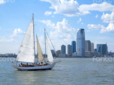 City and a Sail Boat