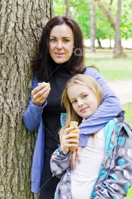 Mother and daughter eating