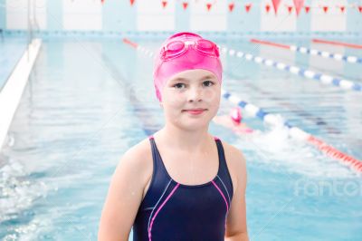 Cute girl in swimming pool