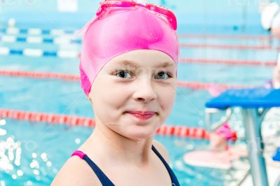Cute girl in swimming pool