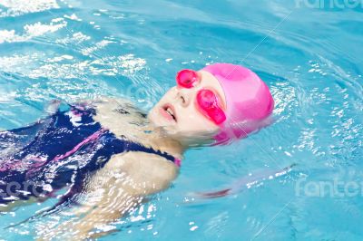Cute girl in swimming pool