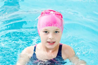 Cute girl in swimming pool