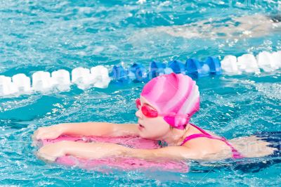 Cute girl in swimming pool