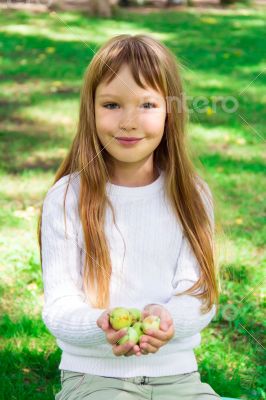 Cute girl with apples