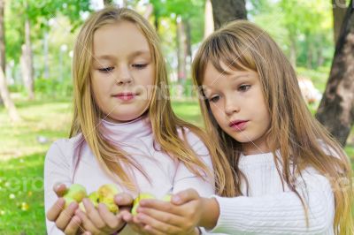 Cute girls with apples