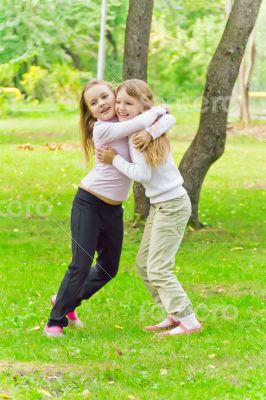 Cute two embracing girls