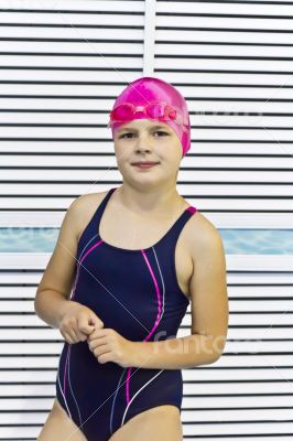 Cute girl in swimming pool