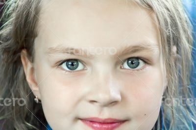 Cute girl with big blue eyes