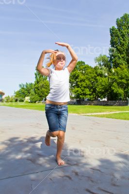 Cute girl jumping on one leg