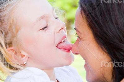Kissing mother and daughter