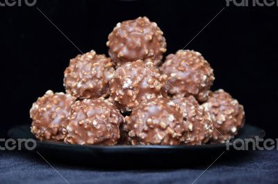 Brown sweet candy on black background
