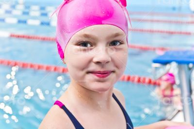 Cute girl in swimming pool