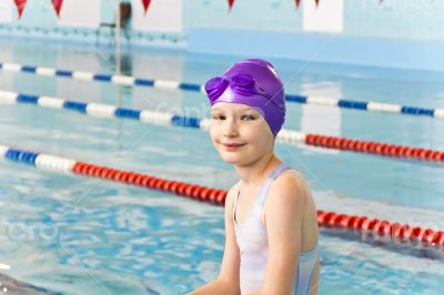 Cute girl in swimming pool