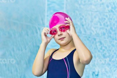 Cute girl in swimming pool