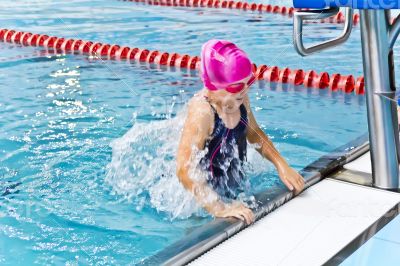 Cute girl in swimming pool