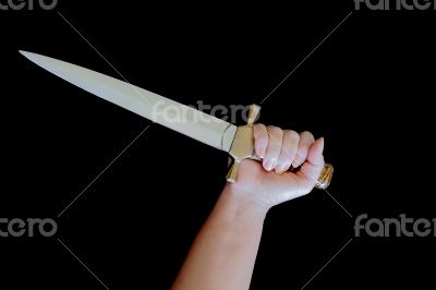 Cold weapon in human hand