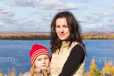 Mother and daughter in autumn