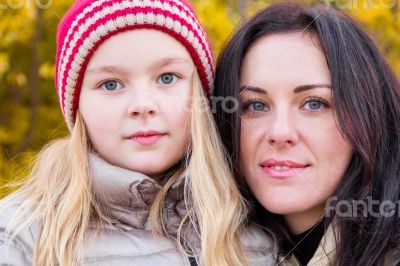 Mother and daughter in autumn