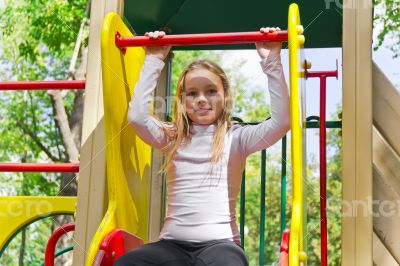 Active girl on nursery platform in summer