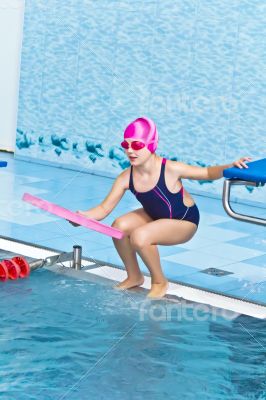 Cute girl in swimming pool