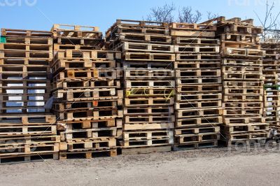 The big stack of wooden cargo pallets