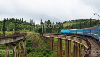 Train going across the bridge in the Carpathians