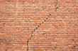 cracked redbrick wall