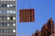 Tower crane lifting concrete frame