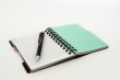 Notebook with a pencil on a white background