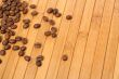 Grains of coffee on a carpet made of a tree