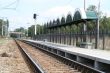 Railway station, rails, wires and a traffic light