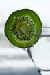 Glass with a plate kiwi