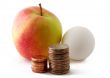Red green apple and egg with coins