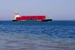 Cargo ship with red containers